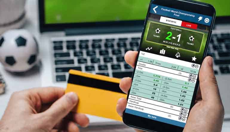 mobile sports gambling card and phone